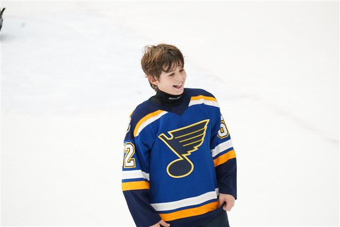 2014 AAA St Louis Blues player smiling on the ice